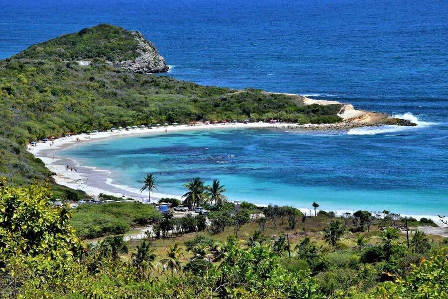 From St John's: Half Moon Bay Beach Half-Day Trip by Van - Natural clay walls and the rocky ends of the bay